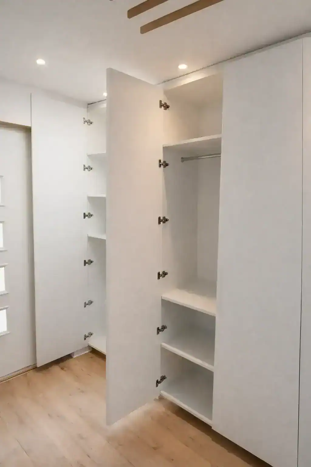 Made-to-measure fitted hallway storage with doors open
